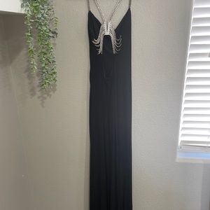 Fitted black form dress with gorgeous rhinestone straps and backing